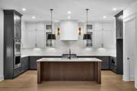 The cabinets, reaching all the way to the ceiling, exude sophistication and provide ample storage space for all your culinary essentials.