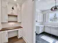 The built-in work station is indeed a productivity oasis within the home, offering a dedicated space where efficiency and organization thrive.