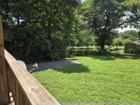 View from deck to the back yard from Unit A