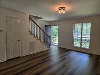 Large Living Room on each side, with a Half Bath next to kitchen area