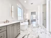 The luxury primary bathroom is more than just a room—it's an experience, a sanctuary, and a retreat from the stresses of everyday life. It's a space offering a haven of tranquility and indulgence that is truly unmatched.