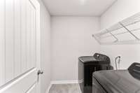 Laundry room with tile floors