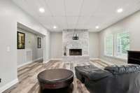 The living space feels bright and open, with low-maintenance LVP flooring throughout the apartment.