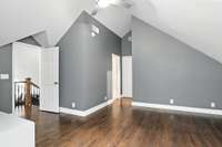 This upstairs bedroom features a charming sloped ceiling and a cozy, creative layout - perfect for a guest room, studio, or hideaway.