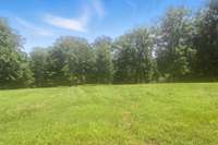 Take in the peaceful park-like setting - mature trees and open lawn as far as the eye can see.
