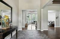 A grand welcome: soaring 14-foot-ceilings make a stunning first impression in the foyer.