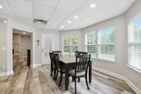 The apartment dining room offers a comfortable space to gather and dine, perfectly integrated into the open layout.
