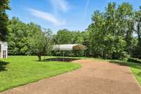 A spacious detached carport provides protected parking just steps from the basement apartment - perfect for a boat, camper, or extra vehicles.