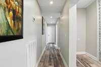 The hallway connects the flex rooms and bedroom to the living room and kitchen.