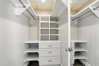 Custom built-ins in the apartment bedroom closet, and a full-length mirror on the closet door!