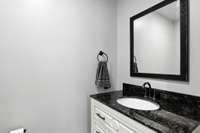 The custom vanity with quartz countertops elevates even a simple space!