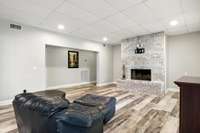 Apartment living room features a wood-burning fireplace and plenty of room to unwind.