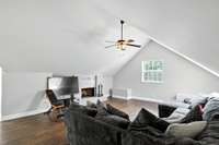 Sunlight by day, firelight by night.  This bonus room is cozy and versatile.