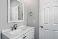 The modern vanity offers convenient storage for a clean, uncluttered look.
