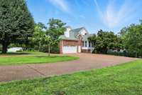 The side-entry garage offers convenient, out-of-sight parking with easy access to the main level of the home.