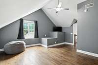 Sloped ceiling + creative vibes.  This upstairs bedroom is a character-filled retreat.