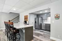 Casual eats, morning coffee, or late-night chats - this kitchen's bar seats four with ease.