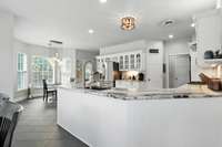 Completely renovated with rare custom granite countertops and new appliances - this kitchen is the heart of the home.