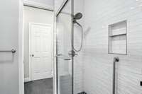 This large tiled shower is shared by bedrooms 2 and 3