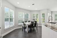 Dinner's ready!  This open space between the kitchen and living room is perfect for a dining table and gathering with friends.