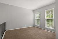 Loft area or home office has lots of natural light