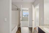 The bathroom can be accessed from the bedroom and main living area!
