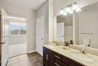 The bathroom features tile floors!