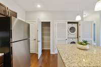 Notice the convenient & spacious pantry with shelving & stacked washer and dryer (which are included). A handy coat closet is located to the left of the pantry, just inside the entryway. Perfection!