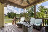 As we go outside you will enjoy the shady covered deck.
