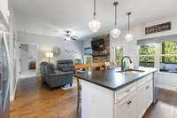 Large island with seating for four is open to the living area.