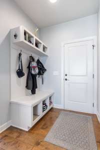 Garage entry for dropping school bags and shoes.
