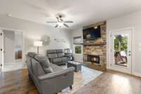 Stone fireplace with custom walnut mantle.
