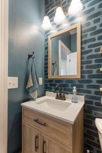 Half bath on main floor with custom paint.
