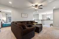 Bedrooms and baths branch off this bonus gathering area perfect for kids.