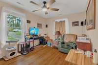 2nd Bedroom with lovely view of front yard, and also a 2nd window (covered) that views the side yard.