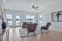 Doors off your living room will lead to your front covered balcony. Photos from a similar plan and are for example only.