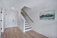 First floor will feature a bedroom, and full bathroom. Photos from a similar plan and are for example only.