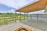 NOTE ABOUT BACK DECK:  The back deck includes a dedicated cut-out and electrical outlet for a hot tub. While the hot tub has been removed, the removable decking that covers the space will be reinstalled within the next few days.