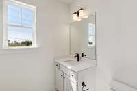 Both full bathrooms enjoy windows and attractive appointments! Actual photo of home.