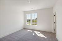 Nine-foot ceilings allow us to put bigger windows into your home. You can simply enjoy the additional natural light they provide! Actual photo of home.