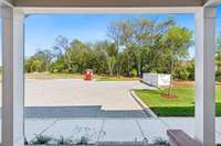 In addition to the front porch, your new home also has a sizable back porch with access to even more parking! Actual photo of home.