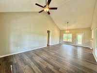 Open living/dining room with vaulted ceiling