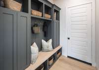 Thoughtful amenities such as benches, coat hooks, and storage cubbies further enhance the functionality and usability of the space, providing a practical and efficient solution for managing the comings and goings of everyday life.