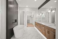 Indulge in a spa-like experience right in the comfort of your own home. A deep soaking tub invites you to unwind & relax after a long day of travel or exploration, while a spacious walk-in shower offers a refreshing escape.