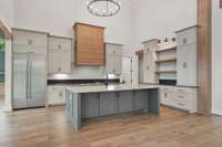 Incorporate features like a hidden pantry, pull-out spice racks, or custom storage for cookware and utensils to keep everything within reach while maintaining a clean aesthetic.