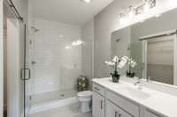 Just off of the bedroom this suite includes a spacious spa-like bathroom beautiful tiled shower