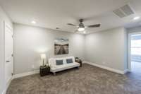 Lets take a look upstairs where you will find this large flex space as well as well as another bedroom