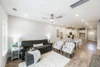 Here you see the large, open living room space. We love the flexibility of this room because it can be arranged in so many ways to fit your needs!  So much room for entertainment. Check out those beautiful hardwood floors that are throughout!