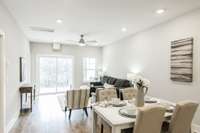 The seamless flow between the living, dining, and kitchen areas allows for easy interaction and movement, making it an ideal space for both daily living and entertaining