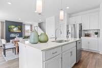 This is a photo of one of our model homes. Please know that some of the exterior and interior finishes, paint, and features may vary.